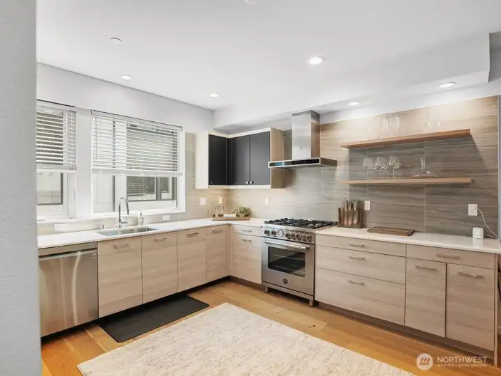 Spacious, modern kitchen is gorgeous & bright.