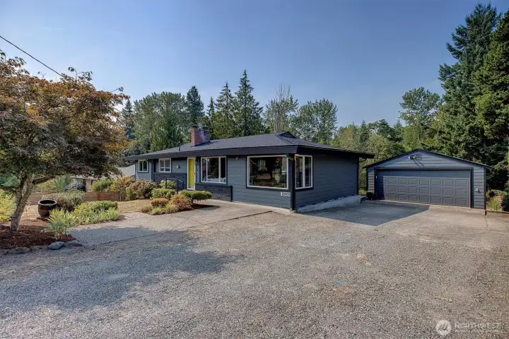 Ample off-street parking with attached two- car garage, storage, and extra driveway space