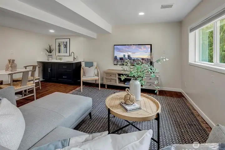 Versatile lower-level space perfect for a media room, home office, or guest suite