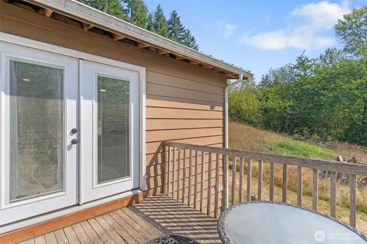 Front door of home with sitting area away from the road