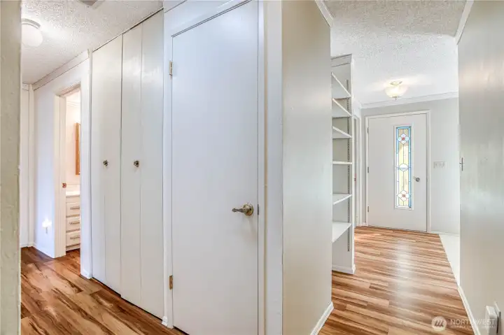 Hallway to two bedrooms and full bath