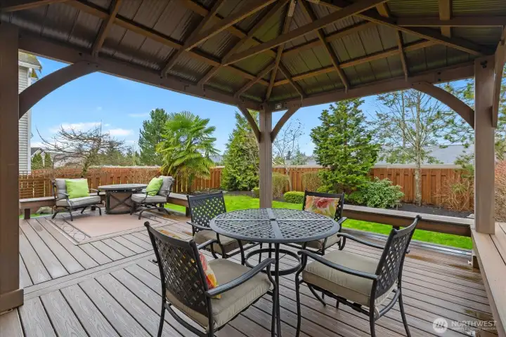 Covered gazebo area off the kitchen provides cover from the sun & rain