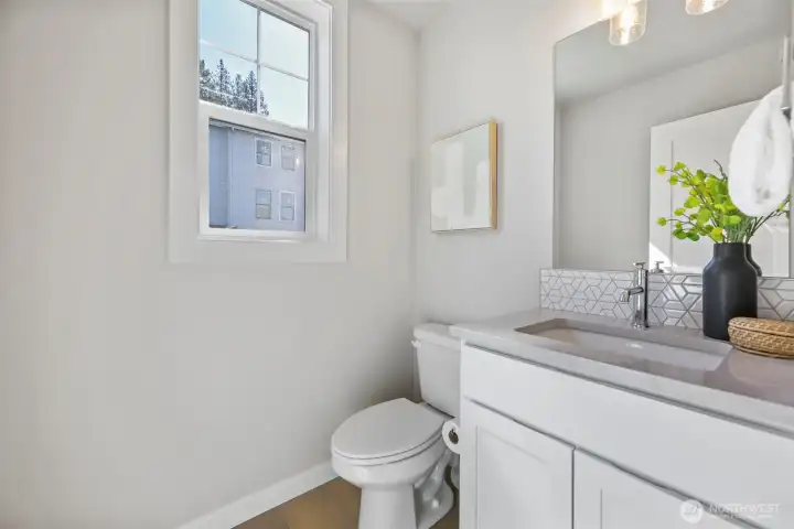 Powder Room. Pictures depict a previously built home similar to the home going to be built on this lot. Floor plans, Elevations, colors, upgrades & materials may be different.