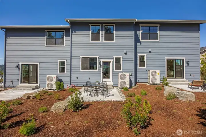 Back of triplex. Pictures depict a previously built home similar to the home going to be built on this lot. Floor plans, Elevations, colors, upgrades & materials may be different.