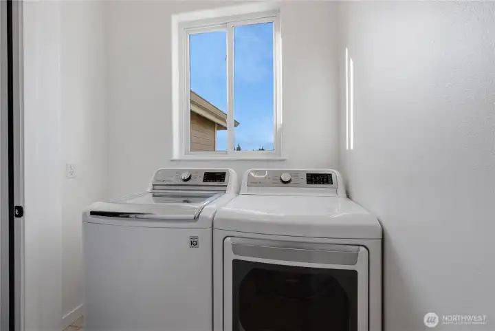 Main floor laundry just off of the garage and entry.