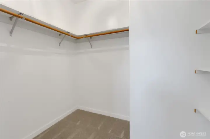 Master walk in closet is large and has shelving as you first enter.  This spacious closet will provide plenty of room to organize your clothes!