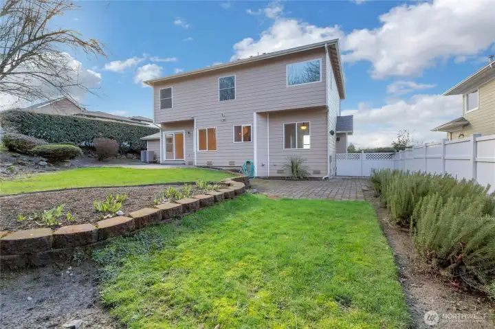 Your backyard is partially fenced, has easy maintenance, water feature, patio area off the sliding glass doors.  There's also an area perfect for a hot tub, which is already wired for.