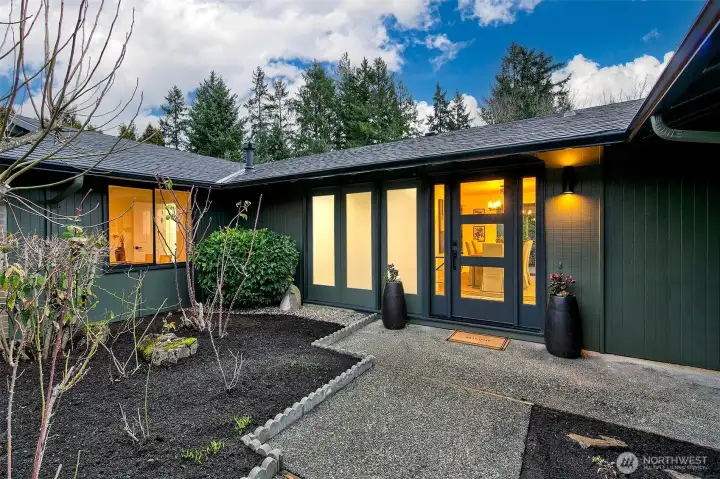 Home is tucked back from the street in this quiet neighborhood.