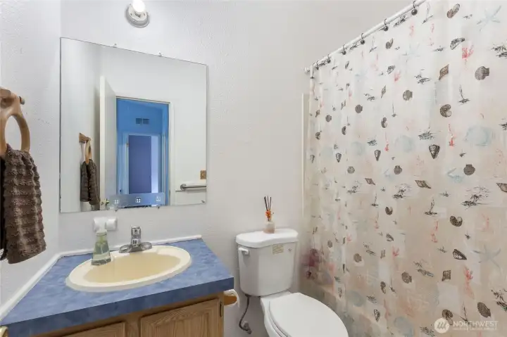 Conveniently located secondary bathroom.