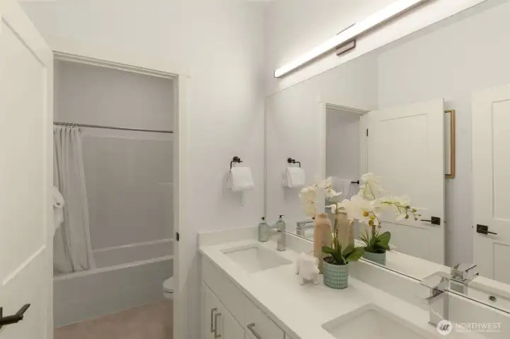 Photos of completed model home on #11. Color, spec, and floorplan may vary.