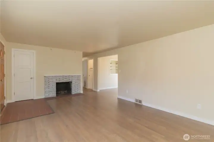 Brick wood burning fireplace in formal living room