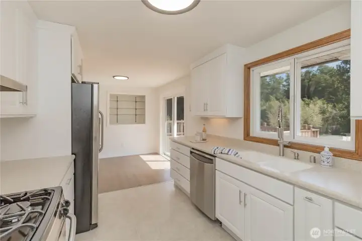 Upstairs kitchen with window overlooking backyard