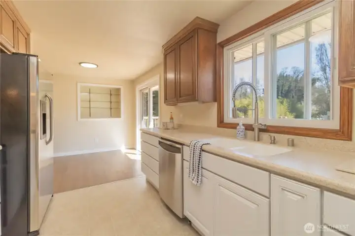Great window and slider with sweeping view of the deck and back yard