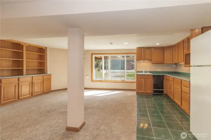 Another view of the huge built-ins to left and kitchen cabinetry