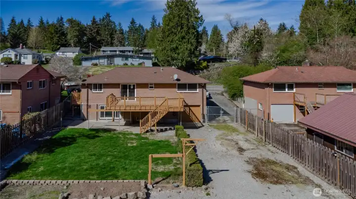 Rear view of the home with tons of additional parking