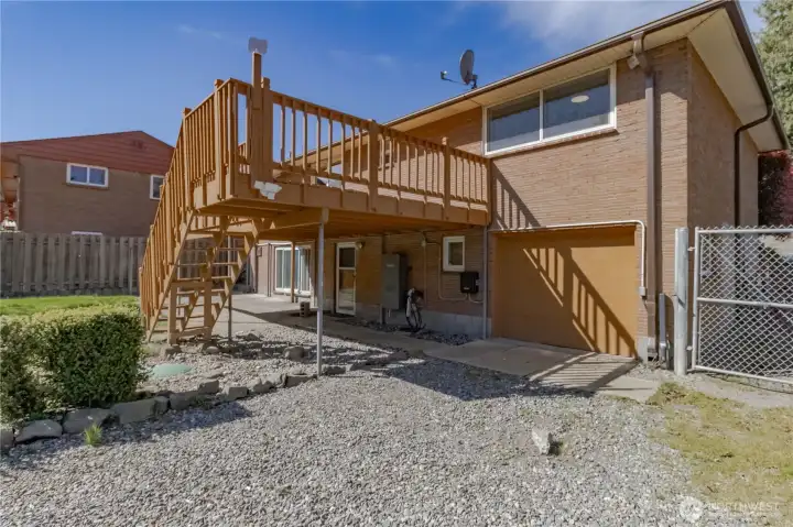 View of back door to basement and garage door to shop area
