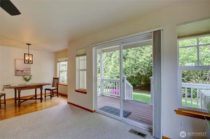 Back deck access with beautiful border of trees.