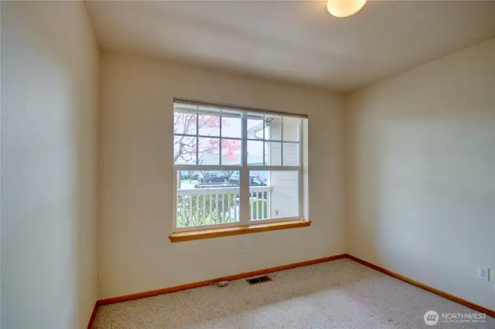 Front bedroom with view of porch and street.  No home directly across.  Would make a great office.