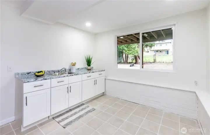 A nice area with cupboard, cabinets & sink!