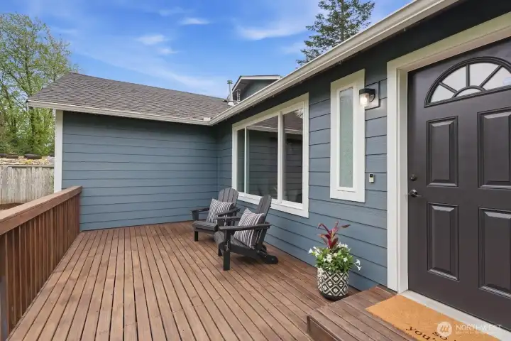 Beautifully extended front porch deck with railing, perfect for relaxing outdoors while adding standout curb appeal.