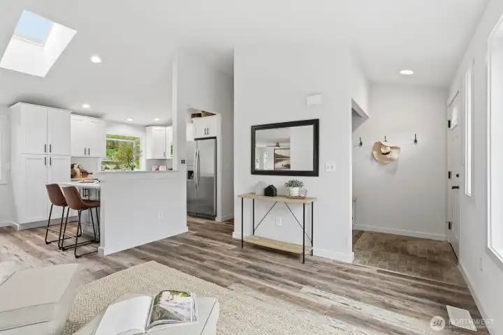 Beautifully updated LVP flooring flows throughout the main living spaces.