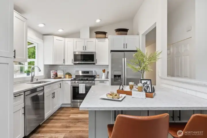 Comfortable eat-in kitchen with bar seating.