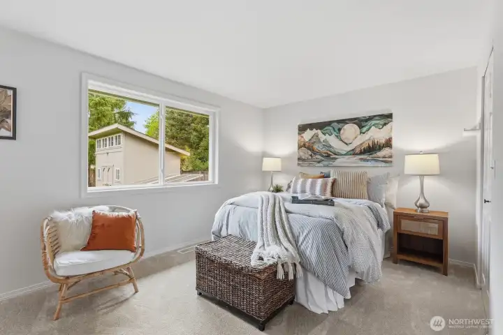 Main-level primary suite complemented by new carpet in all three bedrooms and the hallway.