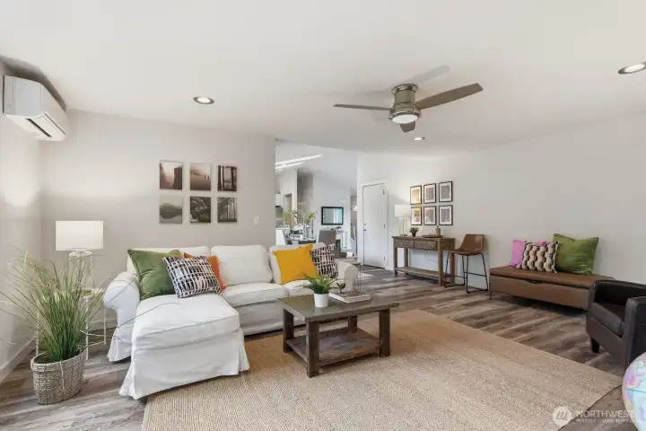 Expansive, cozy family room seamlessly positioned beyond the dining area—including mini-split for year-round comfort.