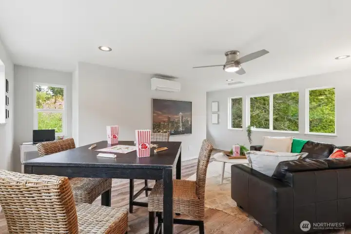 The upstairs offers a spacious, flexible bonus room well-suited for a media lounge, playroom, home office, or multi-generational living.