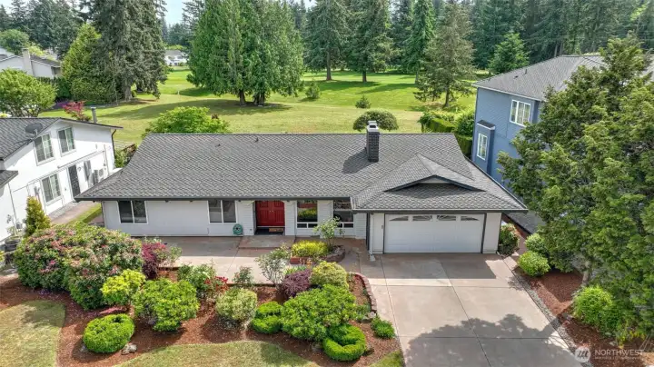 Welcome to an exceptional rambler perfectly positioned on the 8th hole of Fairwood Golf & Country Club. This beautifully maintained home showcases stunning golf course frontage, a sprawling back patio designed for outdoor entertaining, & an oversized primary suite that offers a true retreat. Inside, you’ll find gorgeous hardwood floors, a cozy living room anchored by a gas fireplace, & a kitchen that effortlessly blends marble countertops with timeless mid-century vibes. With a walk-in pantry & sweeping views of the greens, the kitchen is both stylish & highly functional. Welcome to an exceptional rambler perfectly positioned on the 8th hole of Fairwood Golf & Country Club. This beautifully maintained home showcases stunning golf course frontage, a sprawling back patio designed for outdoor entertaining, & an oversized primary suite that offers a true retreat. Inside, you’ll find gorgeous hardwood floors, a cozy living room anchored by a gas fireplace, & a kitchen that effortlessly blends marble countertops with timeless mid-century vibes. With a walk-in pantry & sweeping views of the greens, the kitchen is both stylish & highly functional.