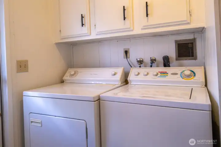 Laundry room with cabinets for all laundry items to be hidden away and houses a full size washer and dryer! Laundry room with cabinets for all laundry items to be hidden away and houses a full size washer and dryer!