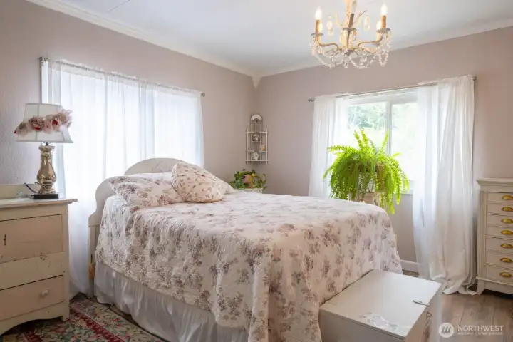 Primary bedroom overlooking the perennial garden and greenbelt. So private! Primary bedroom overlooking the perennial garden and greenbelt. So private!