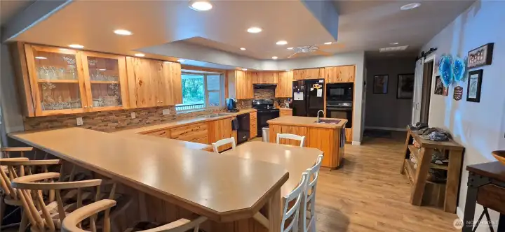 Large kitchen with hickory cabinets