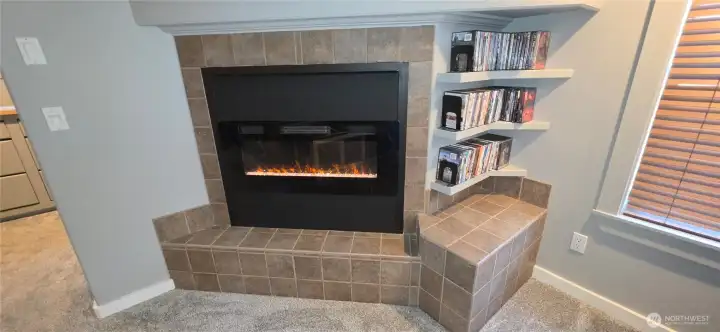 Electric fireplace in primary bedroom