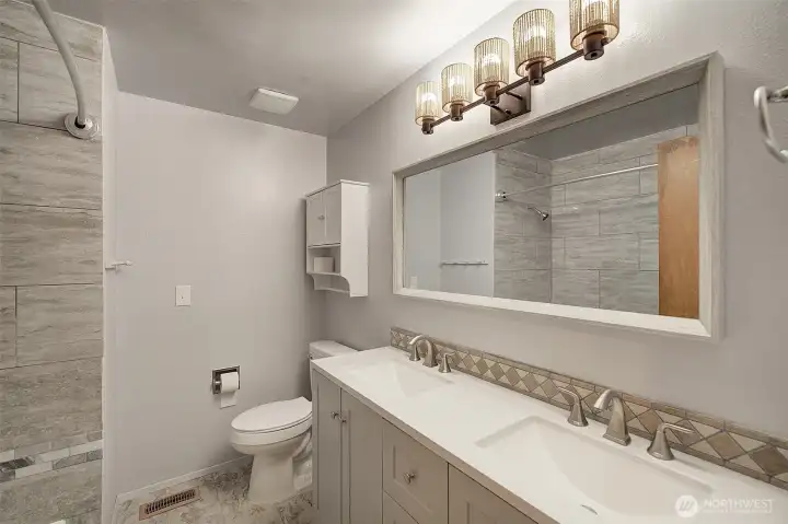 Double vanity makes this very functional, all new counters and tile Double vanity makes this very functional, all new counters and tile