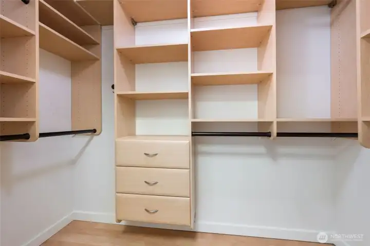 Walk-in closet with California custom installation. Walk-in closet with California custom installation.