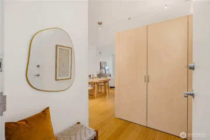 A cozy entry welcomes you home with space to sit and a large closet for your coat, hat, shoes and other sundries. This built-in storage also creates some separation and privacy for the rest of the great room. Such smart design! A cozy entry welcomes you home with space to sit and a large closet for your coat, hat, shoes and other sundries. This built-in storage also creates some separation and privacy for the rest of the great room. Such smart design!