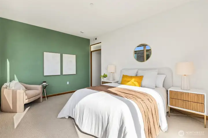 Here, looking from the far corner of the primary bedroom towards the closet and primary bathroom. Note the interior transom window with LED lights above the door, which you’ll find throughout the home. Here, looking from the far corner of the primary bedroom towards the closet and primary bathroom. Note the interior transom window with LED lights above the door, which you’ll find throughout the home.