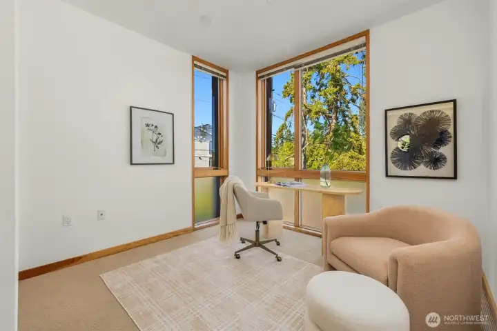 The 3rd bedroom (staged as an office, but with room enough for a queen) is graced by two windows, one facing east and the other north. The 3rd bedroom (staged as an office, but with room enough for a queen) is graced by two windows, one facing east and the other north.
