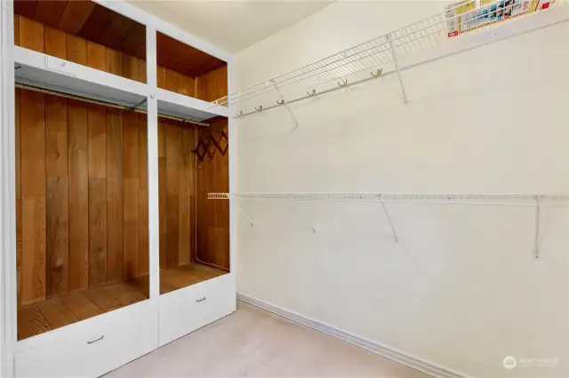 walk in closet with double clothes racks
