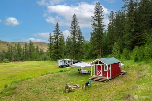 The tiny home with 1/2 bath and kitchen makes deluxe camping a breeze.