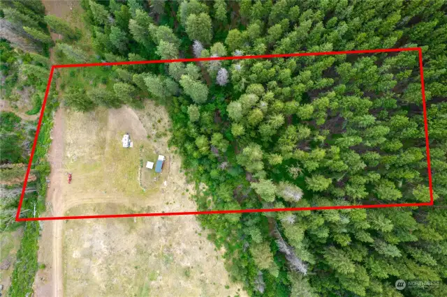 The property has been surveyed with corners marked.  The red outline depicts the general location of the parcel.
