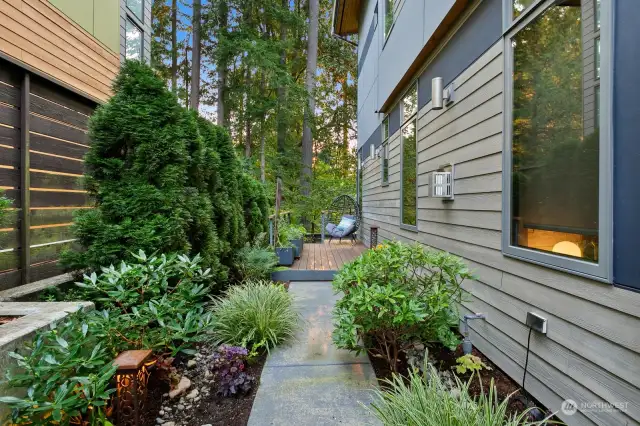 Going towards the Trex deck area with large herbs and veggie planters