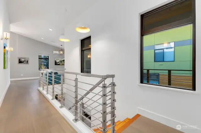 Gorgeous staircase leading to gorgeous landing; upgraded aluminum handrail, top of the line