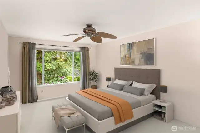 Primary bedroom is spacious and full of natural light