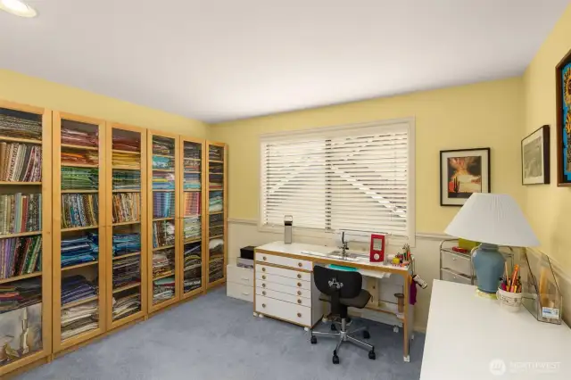1 of 3 upstairs bedrooms. Currently used as a crafting room. All shelving will convey with sellers.