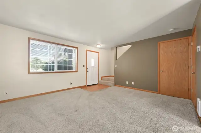 Come right in - this condo has two bedrooms and a bathroom and a half.  The first door leads to the understair storage room.