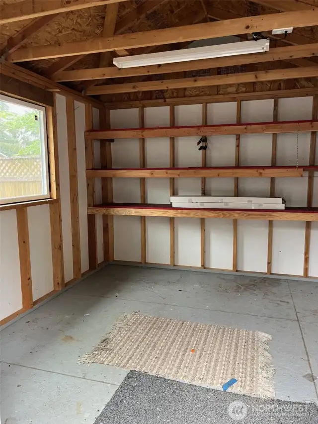 Shed has shelving to hold those craft makings, or garden stuff.