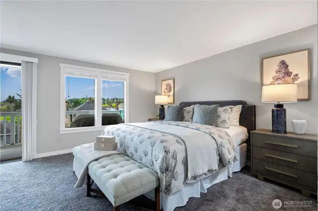 Top floor: Spacious primary bedroom with large windows and peaceful views