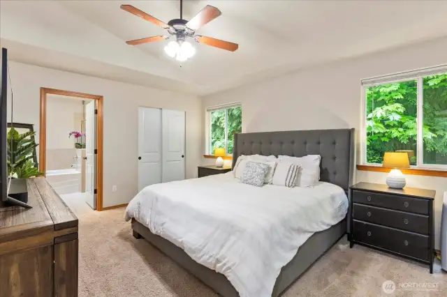Upstairs Primary Suite with vaulted ceilings & fan
